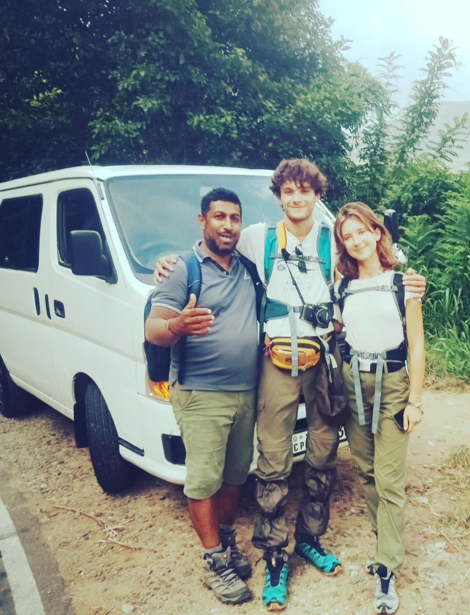 Sri Lankan guide with two travellers at the start of an outdoor adventure
